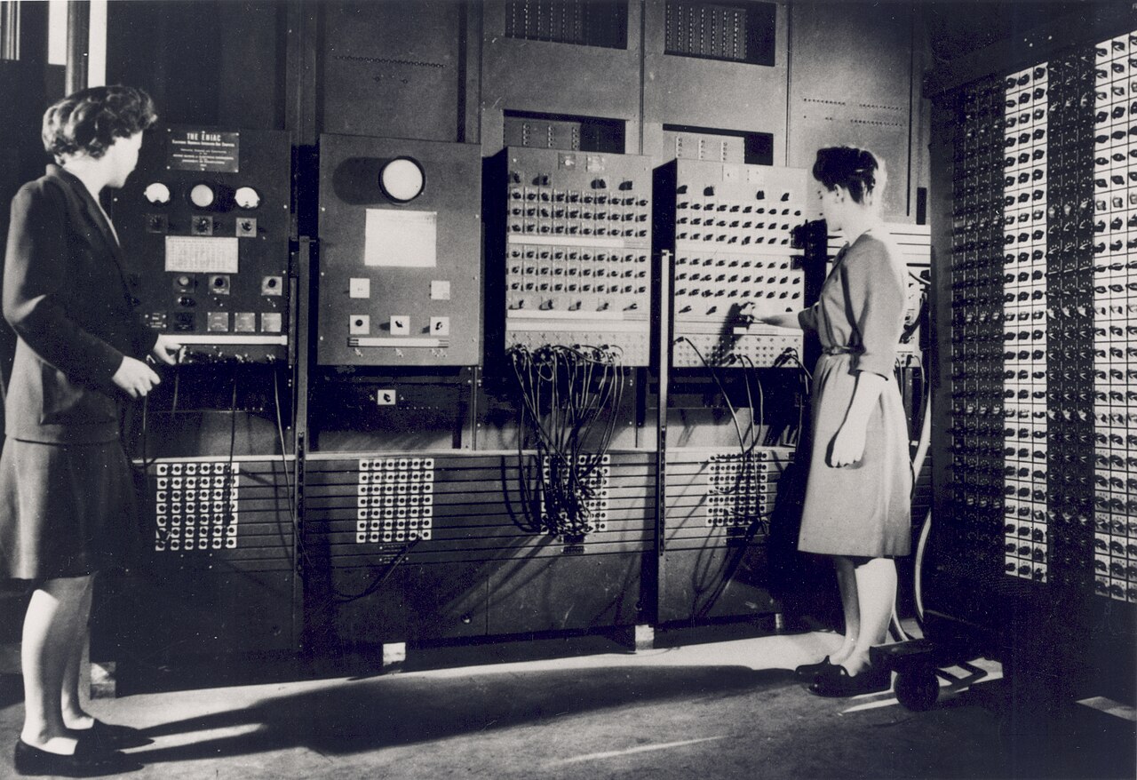 Two programmers operating ENIAC, the first general-purpose electronic computer